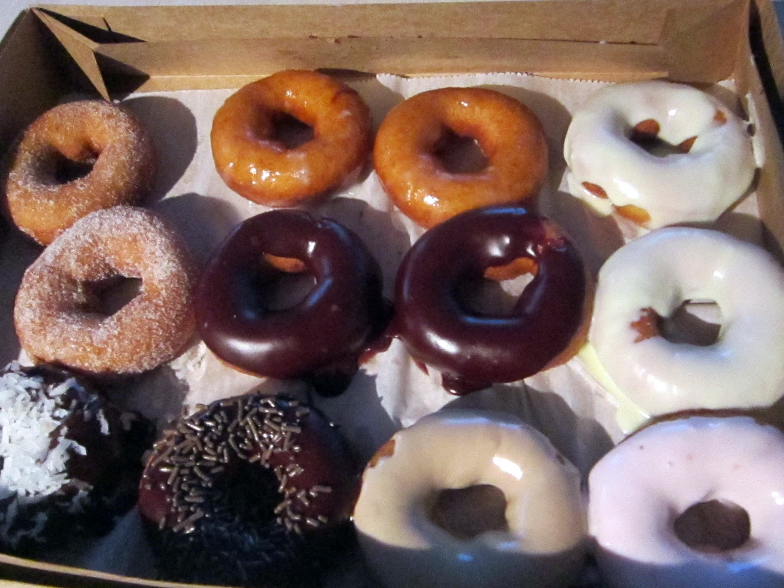 A dozen Dallas donuts to go Open box of assorted donuts ready to share