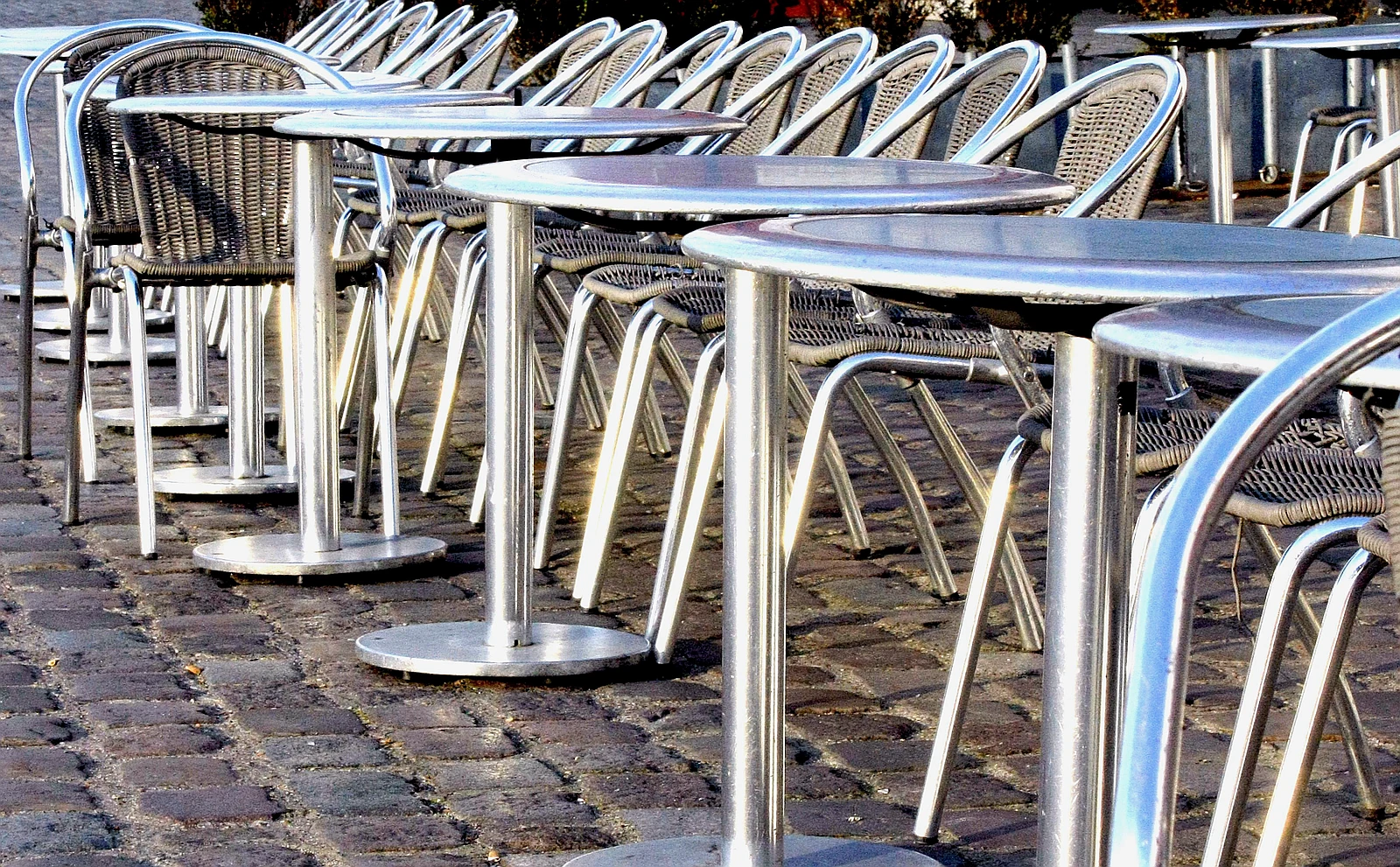 A French bistro terrace with outdoor seating and cafe chairs