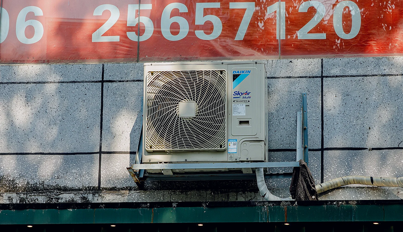 Outdoor residential air conditioning condenser unit, typical of Dallas homes