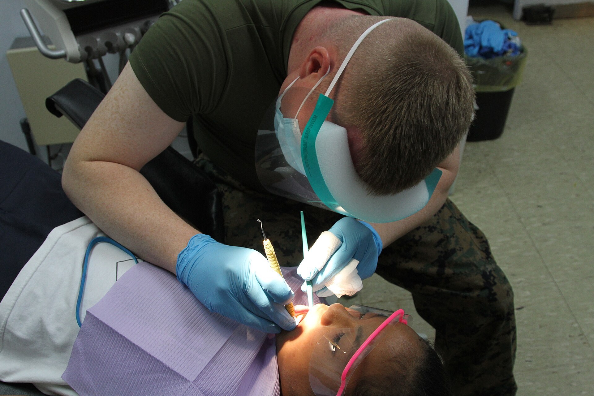 Best Kids Dentists in Dallas - Pediatric Exam Pediatric dentist examining a child's teeth, part of choosing the best kids dentist in Dallas
