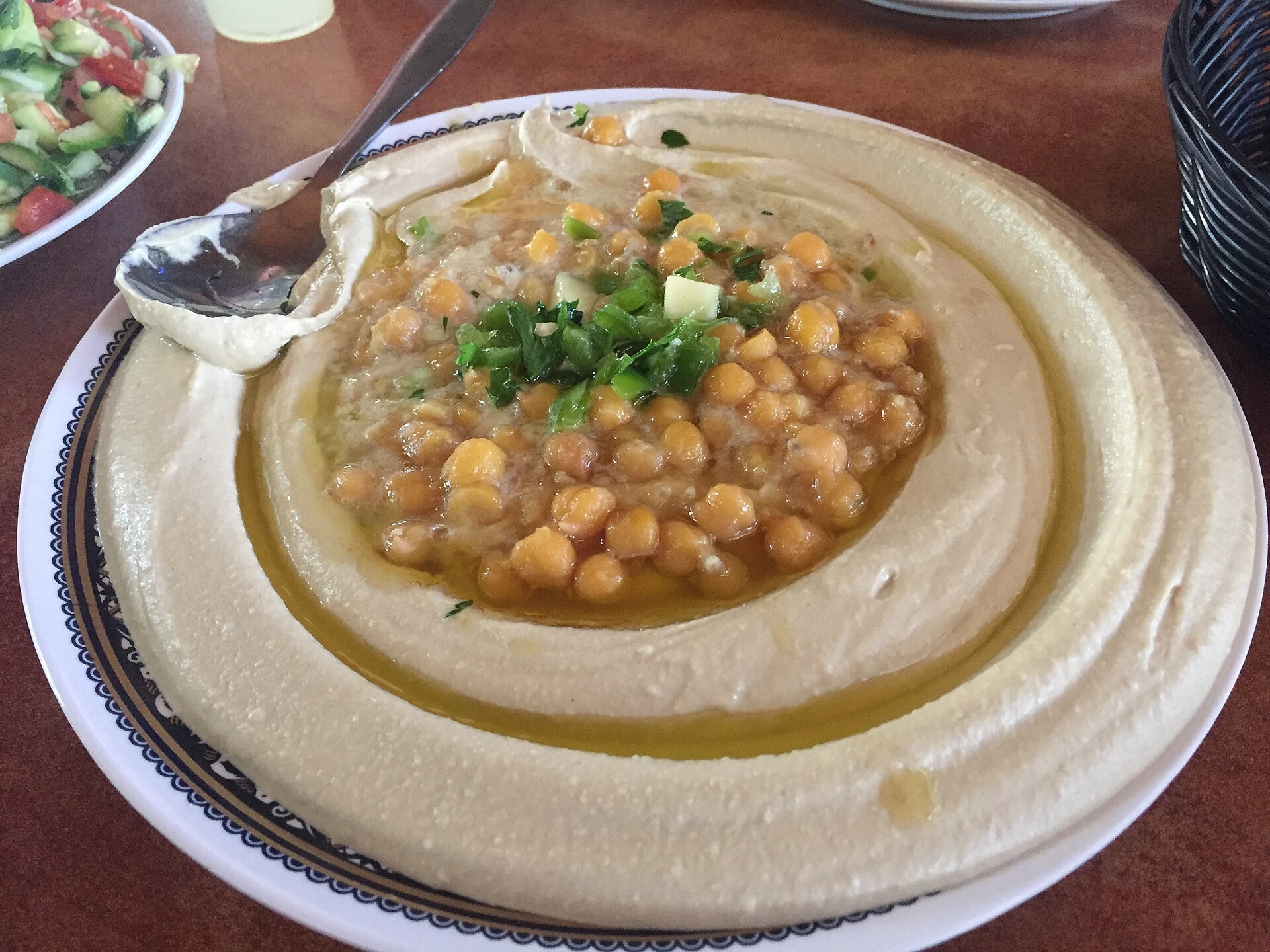 Hummus - the benchmark dish for Dallas Mediterranean spots Hummus plate with olive oil and pita, a benchmark for the best Mediterranean food in Dallas