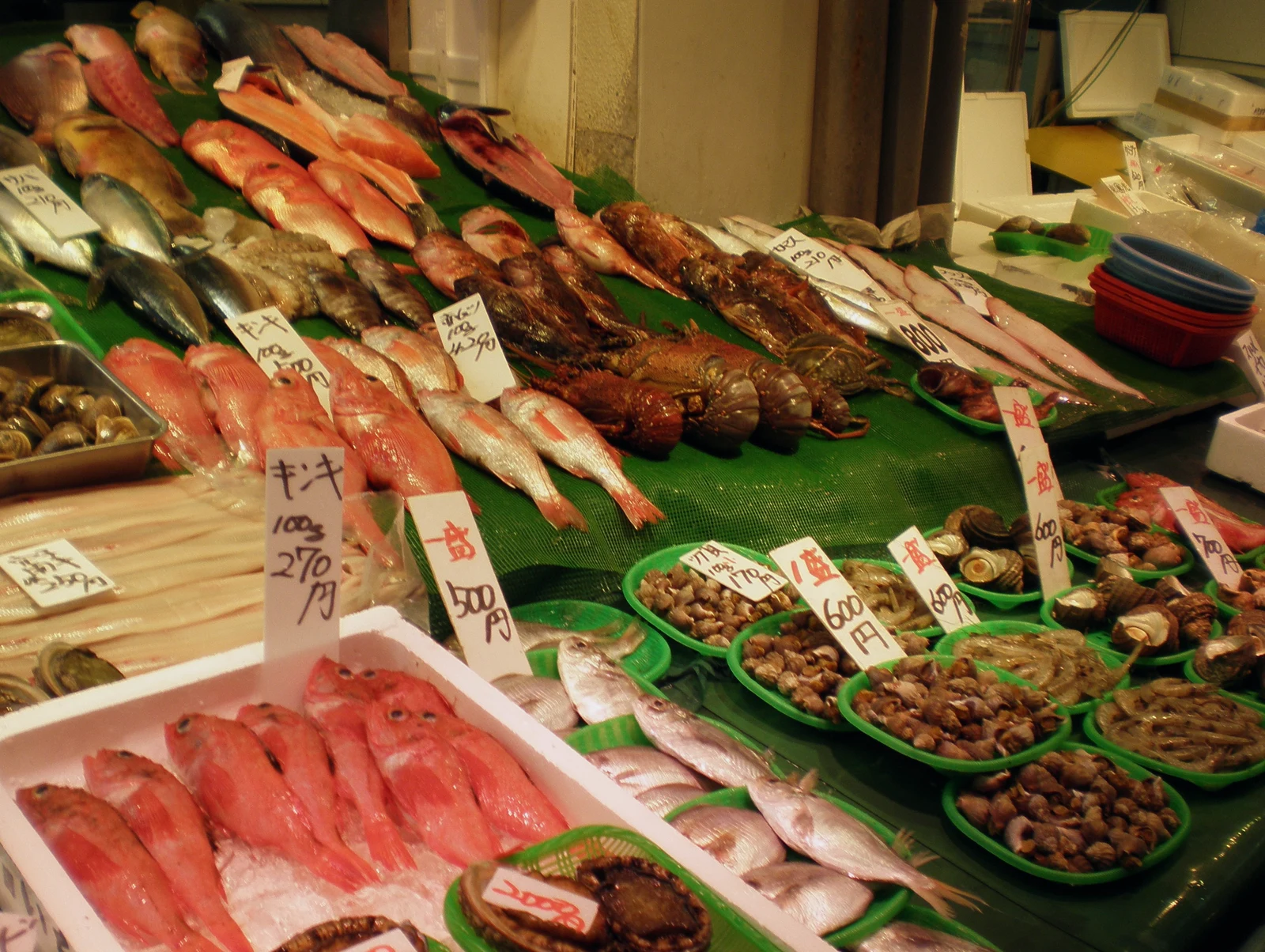 Fresh catch on ice Fresh fish displayed on ice at a seafood market counter