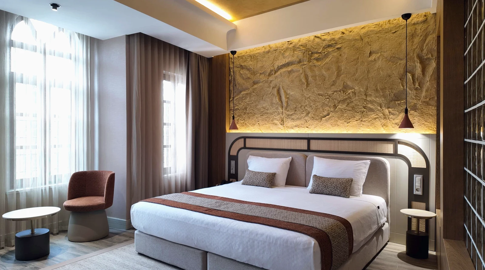 A luxury boutique hotel suite with warm furnishings