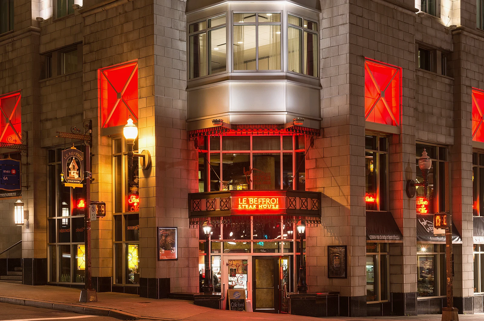 An upscale steakhouse interior with warm lighting and elegant table settings